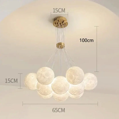 A modern brass-finished decorbites contemporary led pendant featuring illuminated gold moon spheres for dining room decor