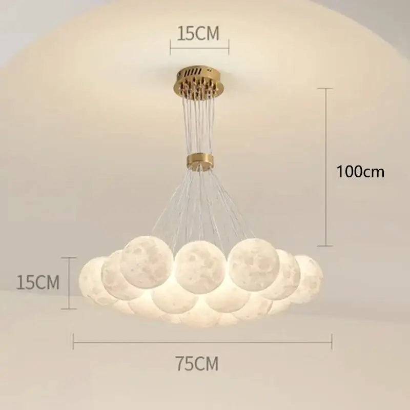A modern decorbites contemporary led pendant light with gold metal frame and illuminated moon-shaped globes for dining room