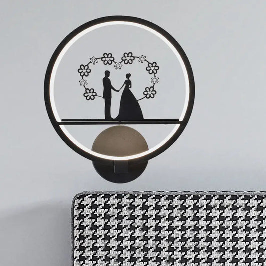 Contemporary lover black circular led wall sconce with glowing ring light and floral silhouette for direct wired electric use