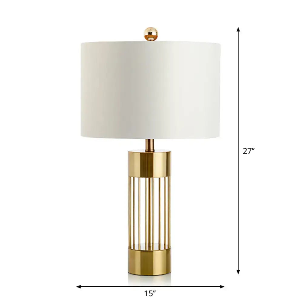 DecorBites™ contemporary metallic cylinder table lamp with brushed gold base and white fabric shade for bedside use