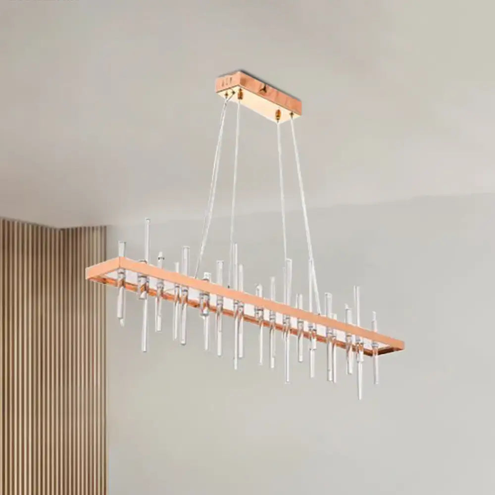 A modern rectangular contemporary rose gold led crystal rod chandelier with clear glass rods for dining room light decorbites