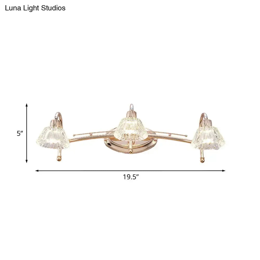 Contemporary rose gold wall vanity light with three clear faceted truncated cone crystal shades for bathroom use