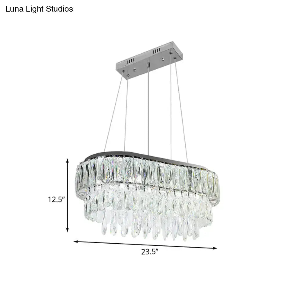Contemporary silver oval crystal drip pendant light with sleek chrome finish and cascading clear faceted crystals