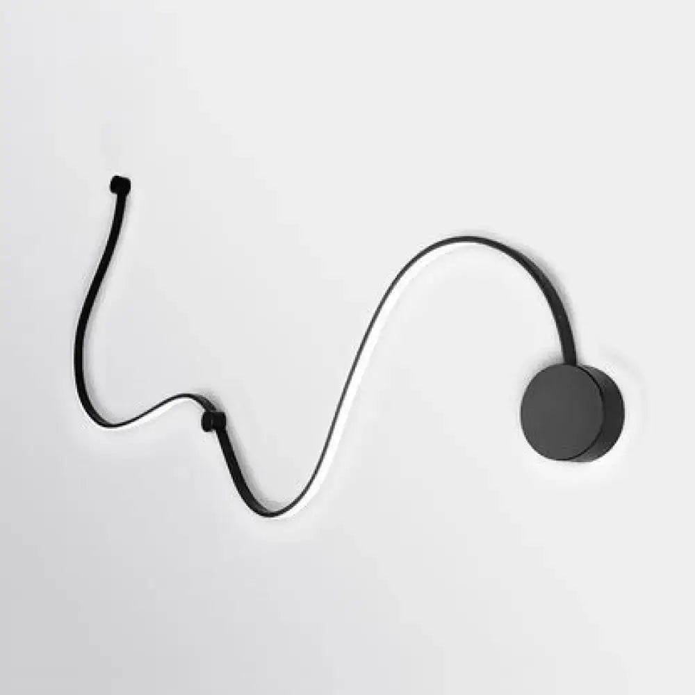 Contemporary twist black wall sconce with sleek curved design and circular base for white warm bedroom lighting