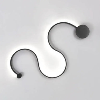 Contemporary twist black wall sconce with sleek s-shaped design and warm white light for bedroom use