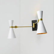 Contemporary white conical wall sconce with gold accents and black mounting plate featuring adjustable arm design