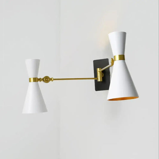 Contemporary white conical wall sconce with gold accents and black mounting plate featuring adjustable arm design