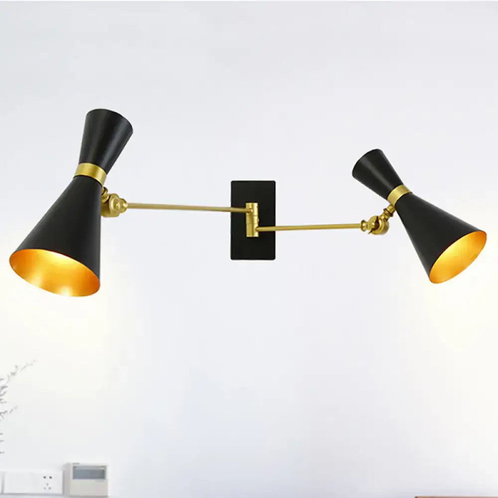 Contemporary black and gold double-arm wall sconce with adjustable arms and conical shades for bedroom lighting