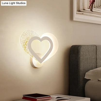 Contemporary white love heart wall mounted light with textured dotted surface and glowing inner frame for bedroom use