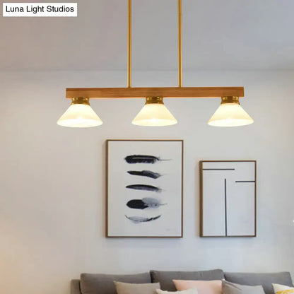 Contemporary wood linear island ceiling light with modern brass finish and gold black pendant shades for dining room