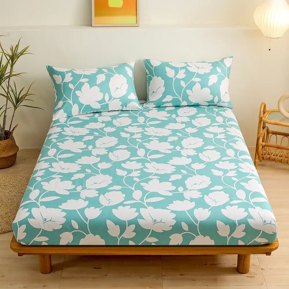 Teal fitted sheet set with white blossoms and vines featuring green leaf flower pattern for bedroom bedding