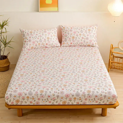 Pastel floral fitted sheet set featuring green leaf flower accents on a soft white background for bedroom bedding
