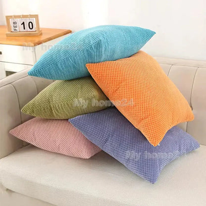 Stack of colorful corduroy corn kernel throw pillowcases in pastel and vibrant hues for living room sofa decorbites decor