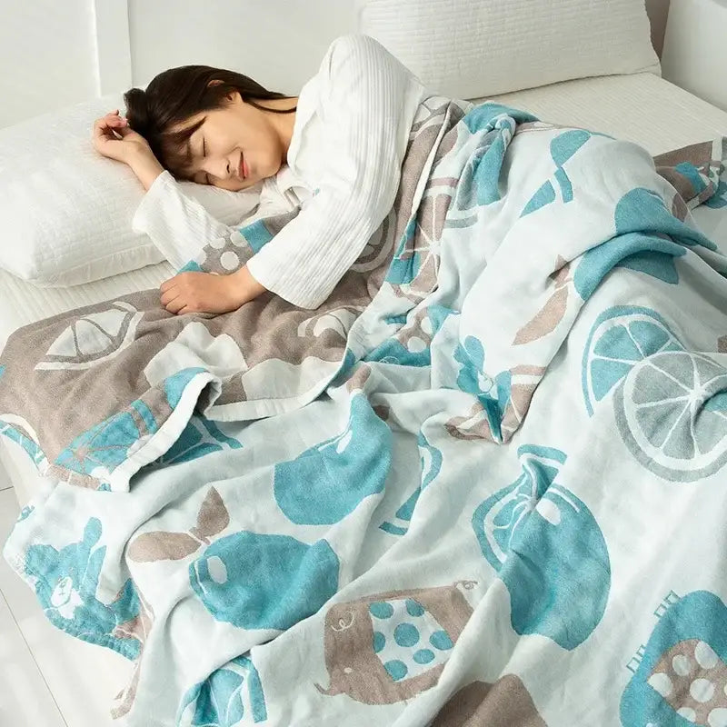 Soft light blue and beige cotton gauze boho throw with whimsical lemon and melon fruits for bedroom decorbites cotton gauze