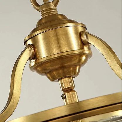 Brass-finished bronze glass chandelier with ornate curved arms and polished sheen pendant lights for dining room decorbites bronze glass