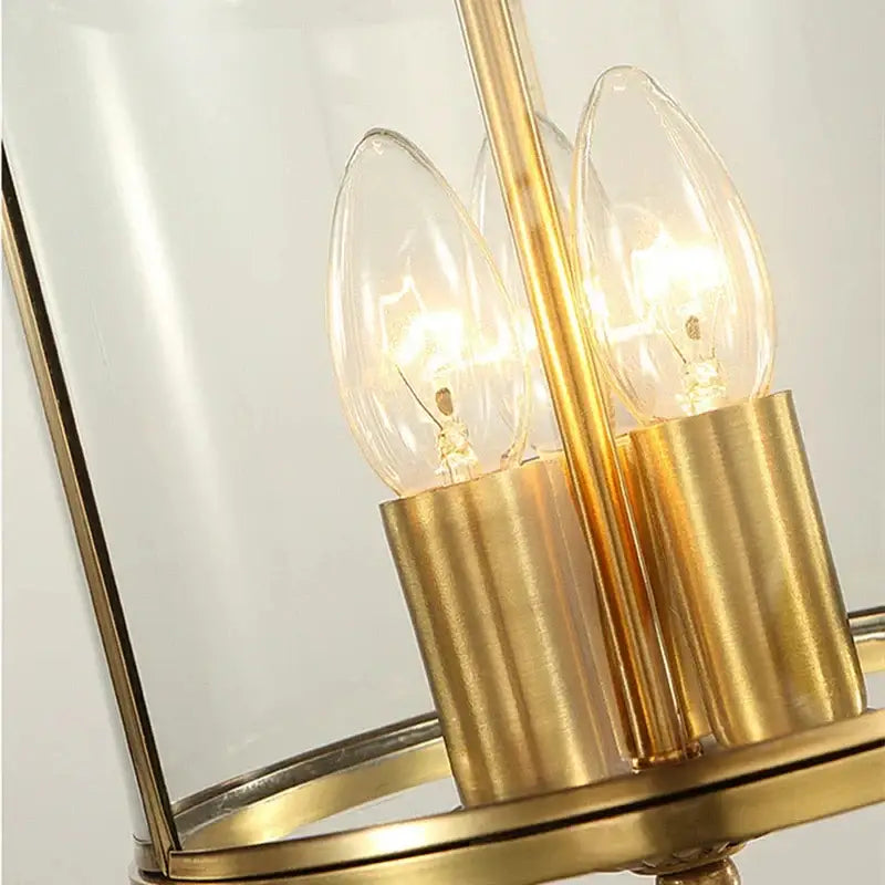 Country bronze glass chandelier lantern with gold-toned metal and clear panels featuring three filament bulbs pendant lights decorbites bronze glass