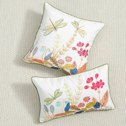 White floral embroidered cushion cover with colorful dragonflies and olive green piping for living room décor