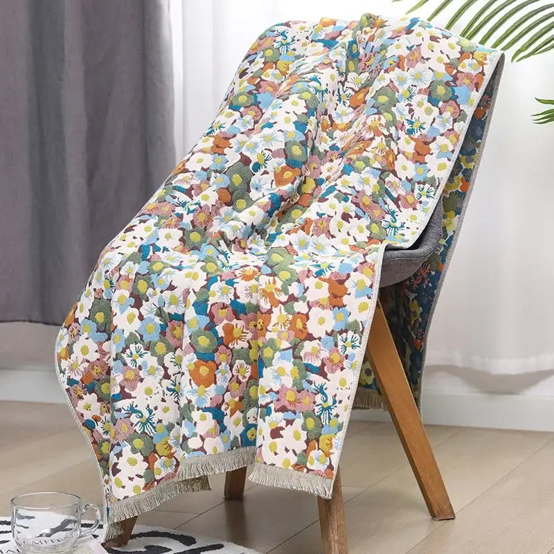 A cozy country flowers cotton floral knit throw blanket with multicolored design and fringed edges for decorbites decor