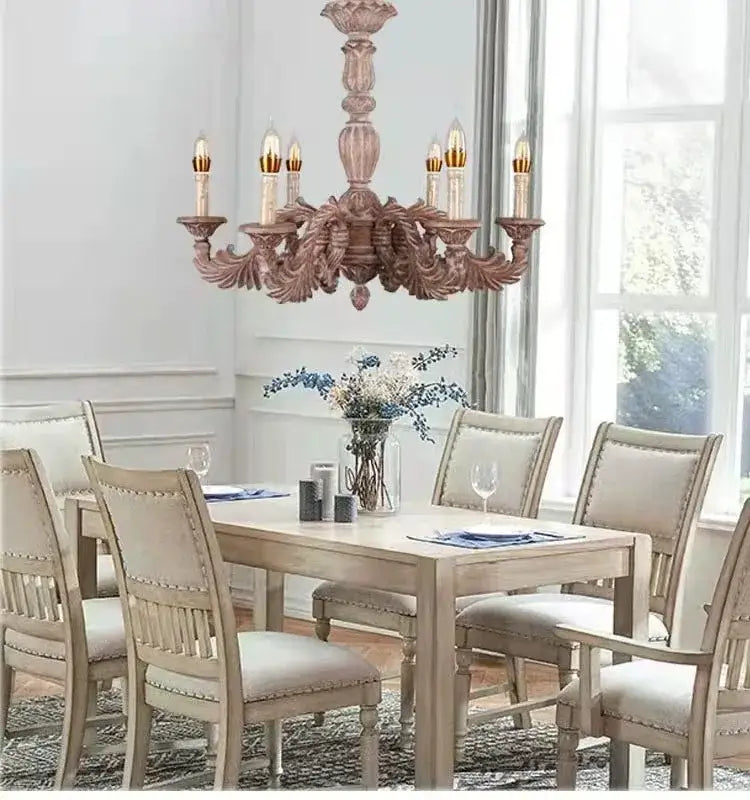 Country french solid wood chandelier with ornate carved wooden arms and soft pinkish brown finish for dining room decorbites country french