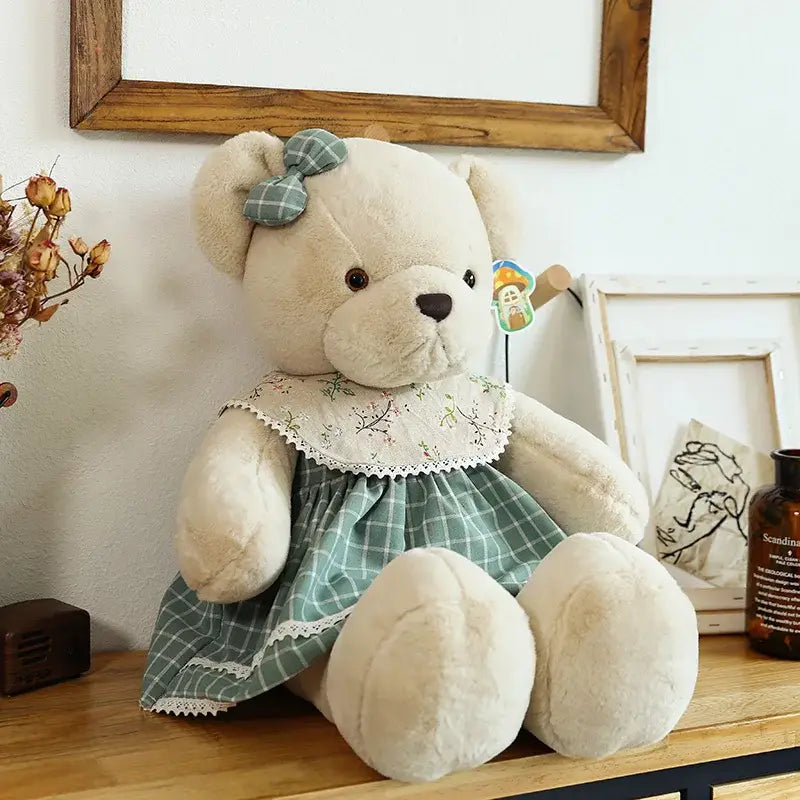 Cream-colored plush couple bear wearing green plaid dress with lace trim and matching bow for DecorBites Christmas gift