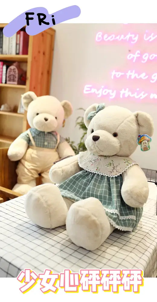 Cream-colored plush toys couple bear wearing green and white checkered dress with lace trim from decorbites