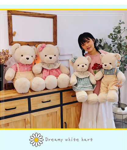 Four cream-colored plush toys featuring couple bear plush dressed in pink and green plaid outfits for christmas gift