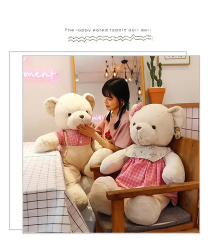 Soft white plush toys featuring a couple bear plush dressed in pink and beige outfits perfect as christmas gifts