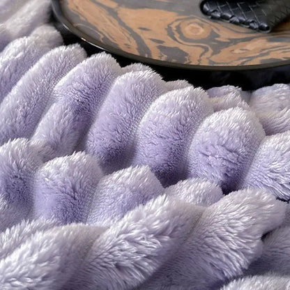 A cozy coral fleece lavender throw blanket with soft textured wave pattern perfect for living room decorbites cozy coral