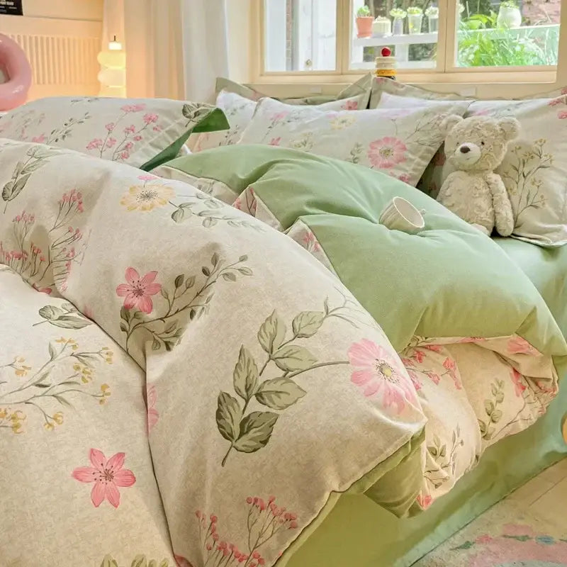 Soft cream-colored cotton duvet cover with pink green floral embroidery paired with mint-green cozy cotton bedding set by decorbites