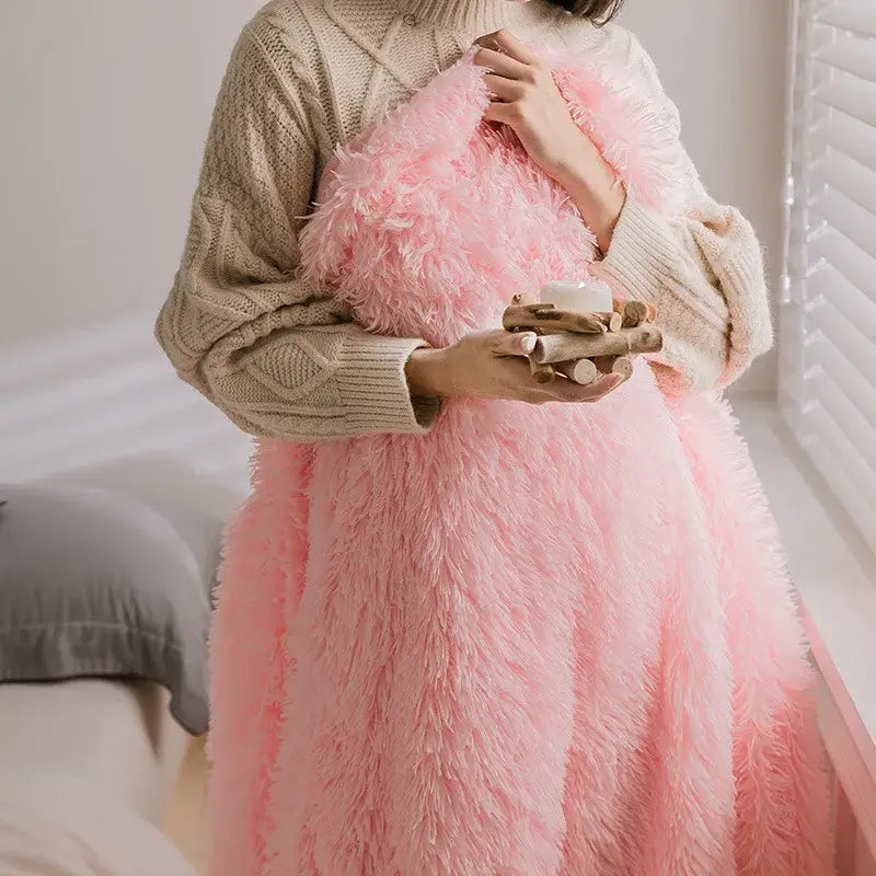 A soft fluffy pink cozy faux fur throw blanket with plush long-haired texture ideal for bedroom decorbites cozy faux use