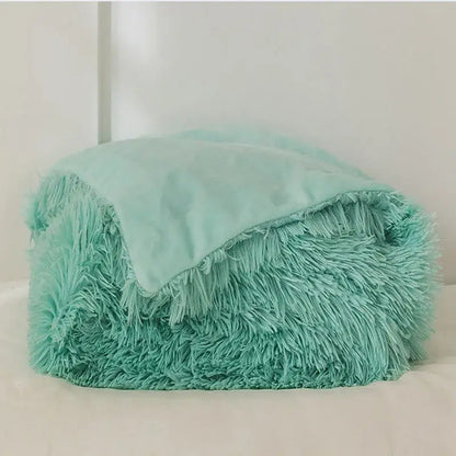 A cozy faux fur throw blanket in mint green with soft inner lining perfect for plush decorbites cozy faux decor