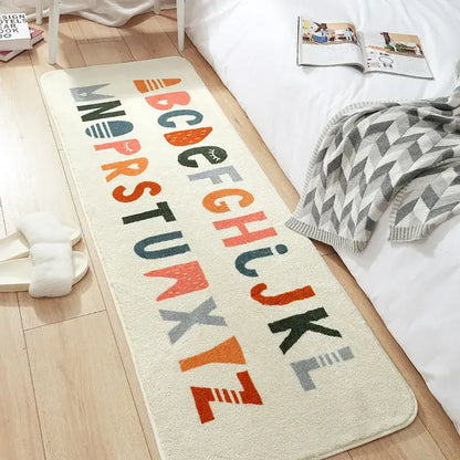 Cream-colored decorbites cozy faux lamb bedside rug with colorful playful alphabet letters for bedroom use