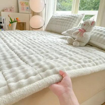 Soft white quilted bed pad with plush terry cloth edges in decorbites cozy faux rabbit fur pink and white mattress pad
