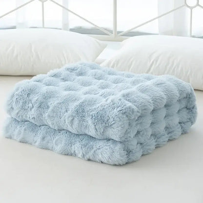A soft light blue cozy faux rabbit velvet throw blanket with plush quilted texture for bedroom decorbites cozy faux use