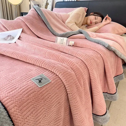 Pink plush cozy jacquard plush blanket with gray border and textured weave featuring decorbites cozy jacquard patch