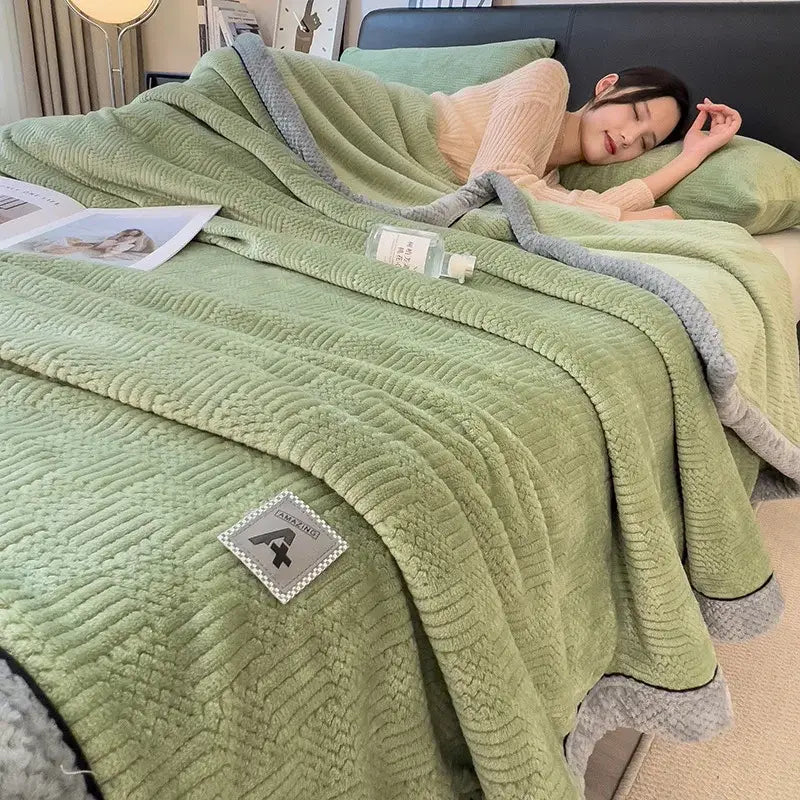 Soft mint green decorbites cozy jacquard plush blanket with textured waffle weave and gray ribbed trim edges