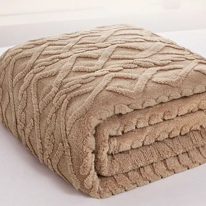 Beige plush blanket with textured cable knit pattern from decorbites cozy jacquard plush sofa throw collection