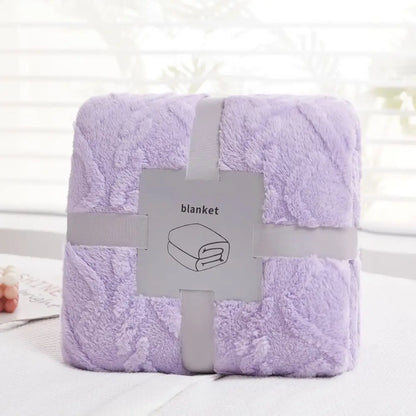 A plush lavender decorbites cozy jacquard throw blanket with soft textured surface neatly wrapped in gray ribbon