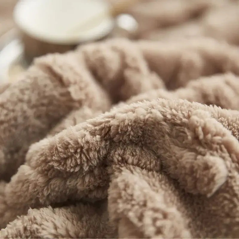 Soft beige plush blanket with a cozy jacquard textured surface perfect for sofa throw and home decorbites cozy jacquard plush