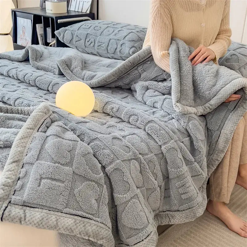 Soft gray plush flannel nap blanket with textured geometric pattern and cozy fleece finish decorbites cozy jacquard taffeta