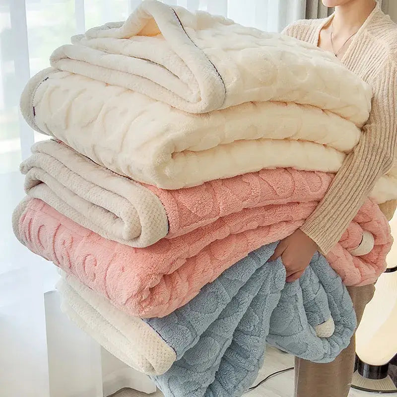 Stack of decorbites cozy jacquard taffeta flannel nap blankets in cream blush pink and light blue with soft fleece texture