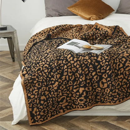 A cozy leopard print knitted black and tan throw blanket with a soft textured surface for bedroom decorbites cozy leopard