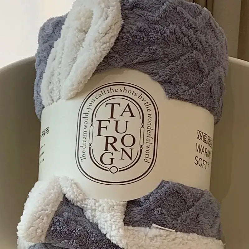 Cozy gray and white coral fleece blanket with a plush textured surface perfect as a sherpa throw for bedroom use