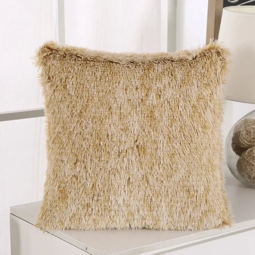 Beige faux fur throw pillow with shaggy textured surface and frayed edges decorbites cozy plush cushion cover