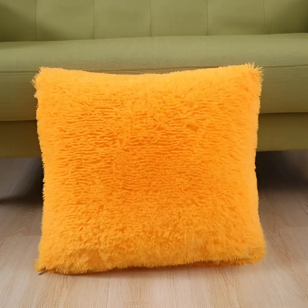 Vibrant orange cozy plush fur throw pillow with shaggy texture suitable as a decorbites cozy plush cushion cover