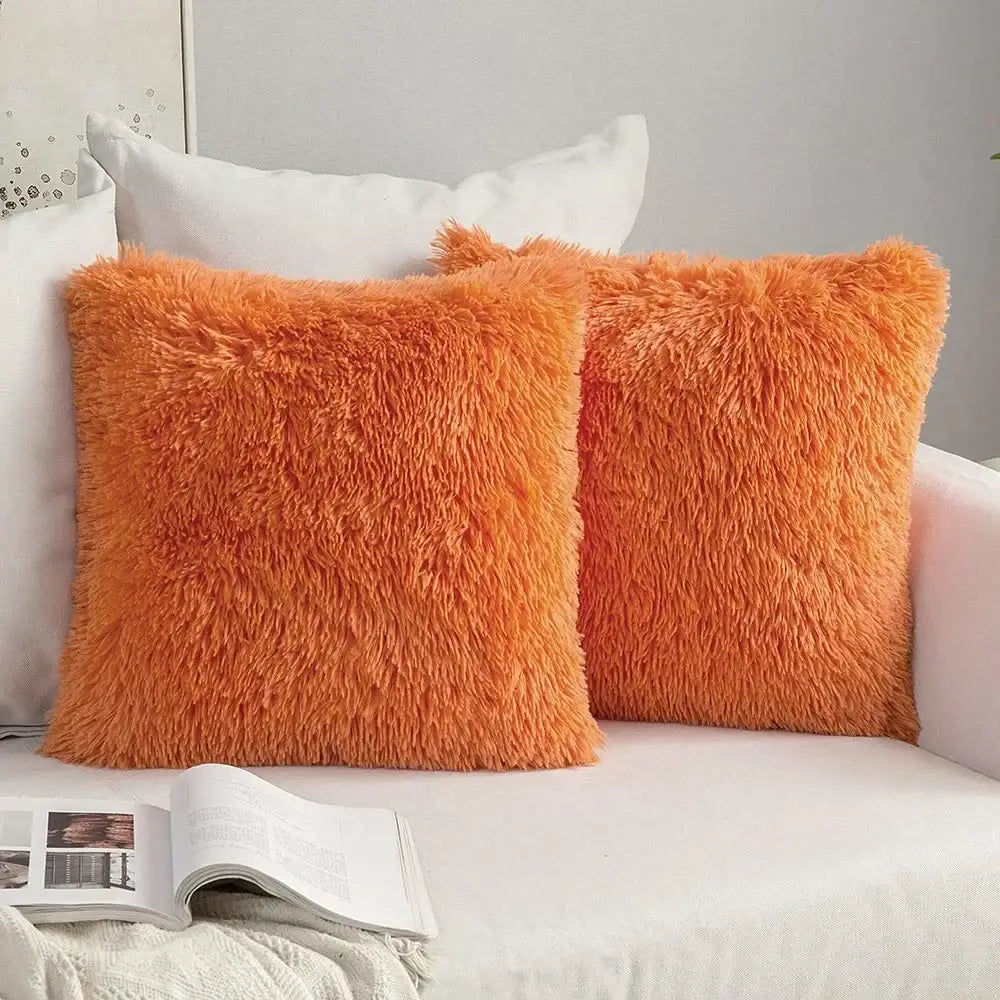 Two vibrant orange plush fur cushion covers with a soft shaggy texture for decorbites cozy plush living room decor