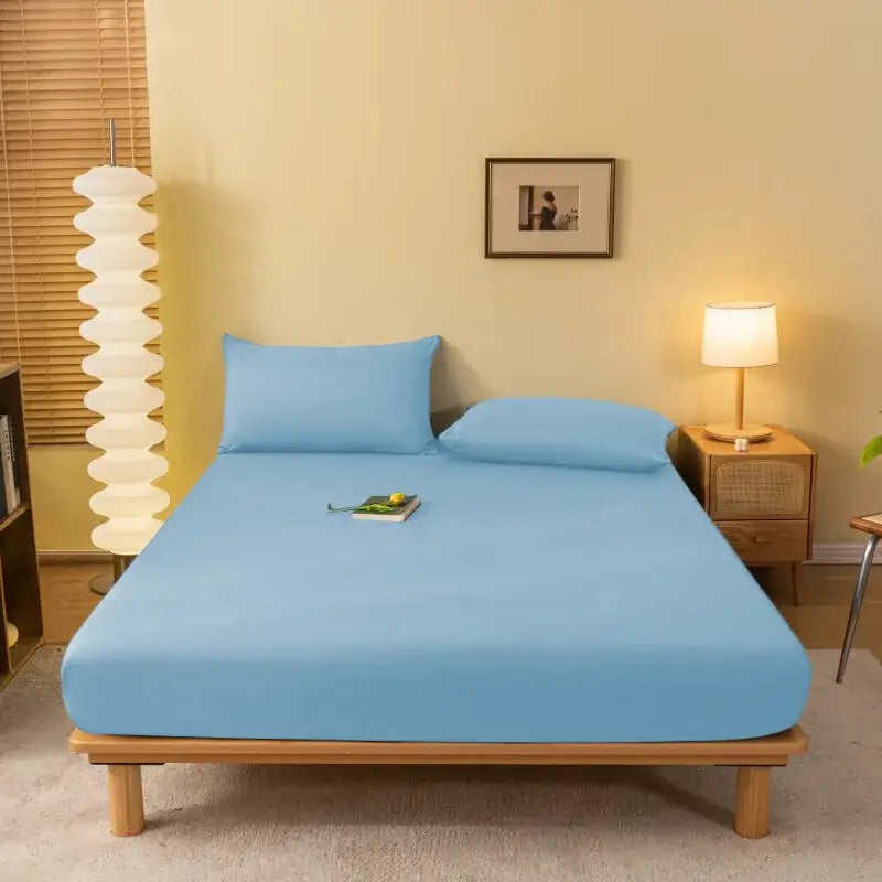 Light blue cozy solid color fitted sheet with matching pillowcases made of smooth stretchy fabric by decorbites cozy solid