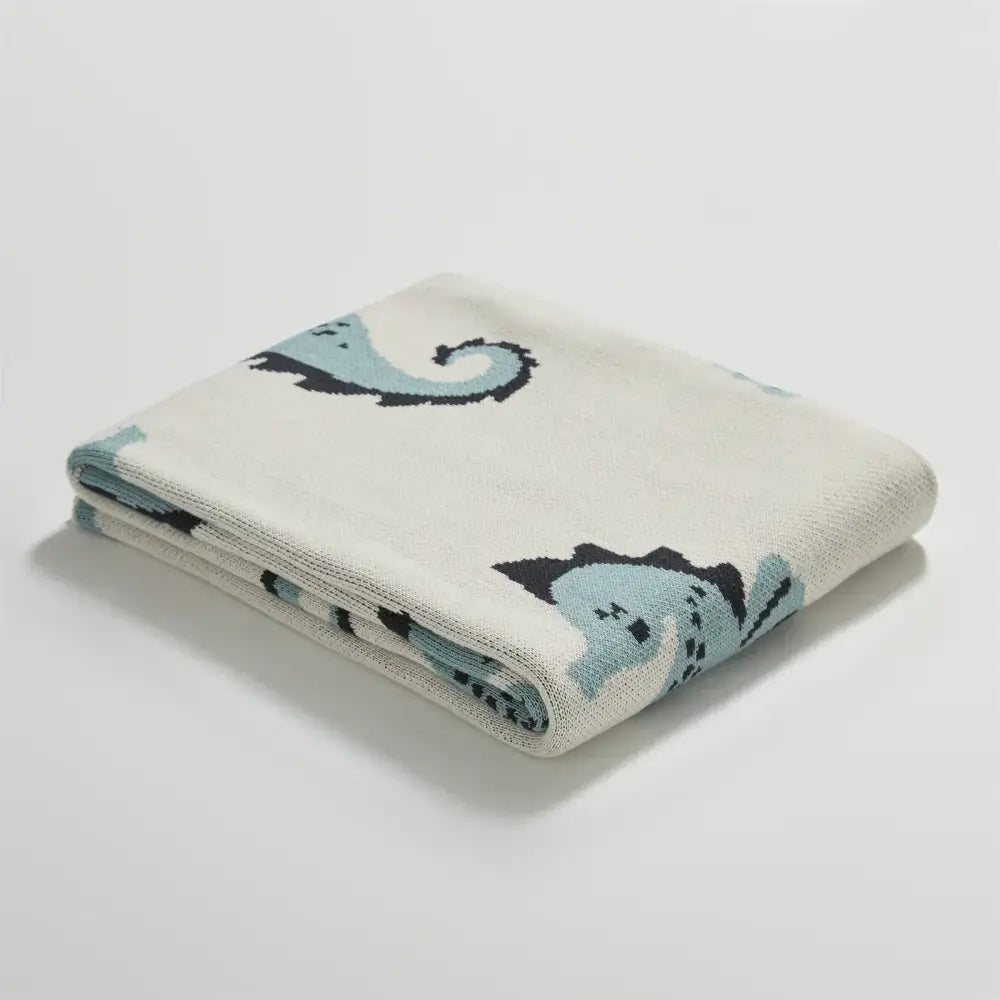 A cream and blue cute sea horse cotton knitted blanket with playful seahorse pattern for bedroom decorbites cute sea decor