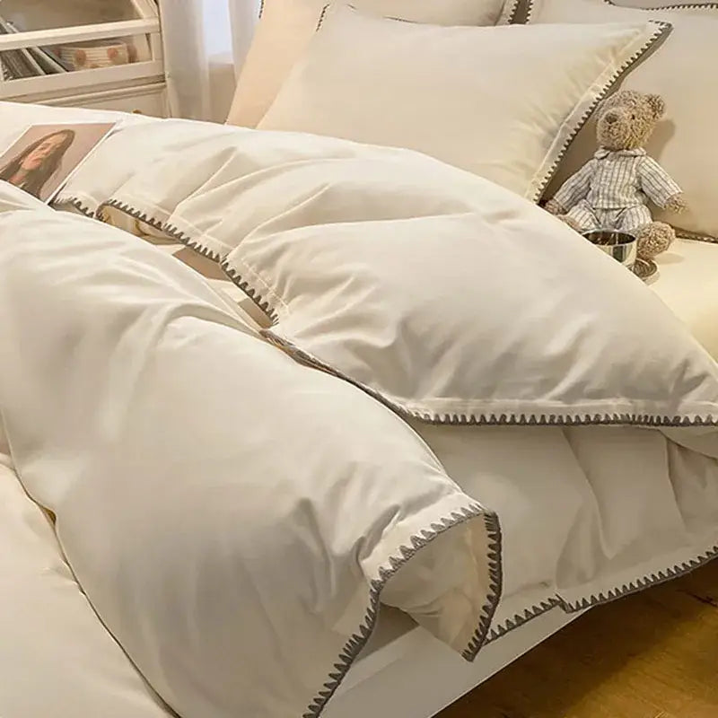 Cream and gray zigzag quilted bedding set with decorbites cozy shell edges featuring cream color and subtle gray stitch