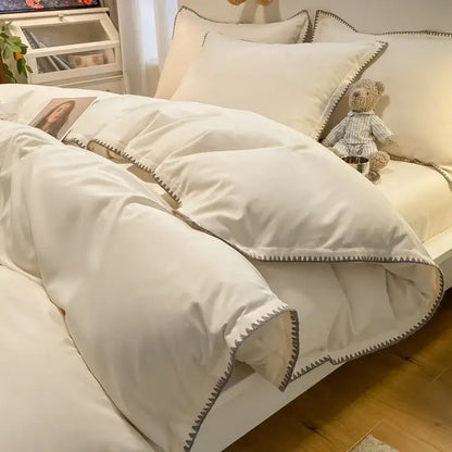 Cream and gray zigzag quilted bedding set with cozy shell edges featuring cream-colored fabric and subtle gray stitch decorbites cozy shell